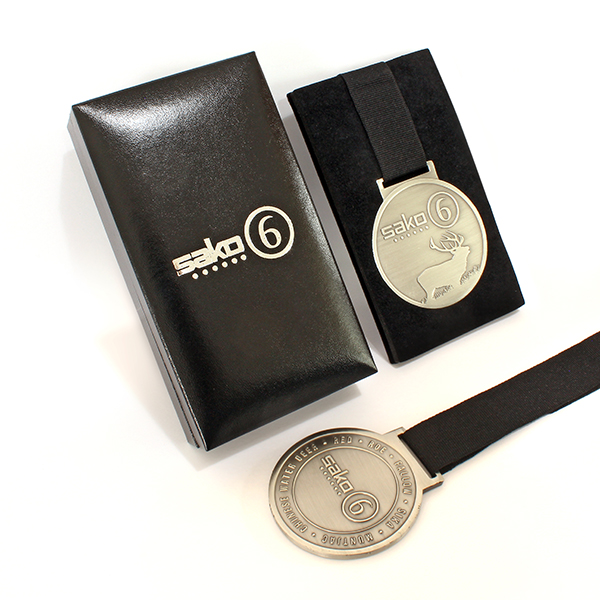 Sako 6 Commemorative Medal features a black ribbon and is displayed in a presentation case