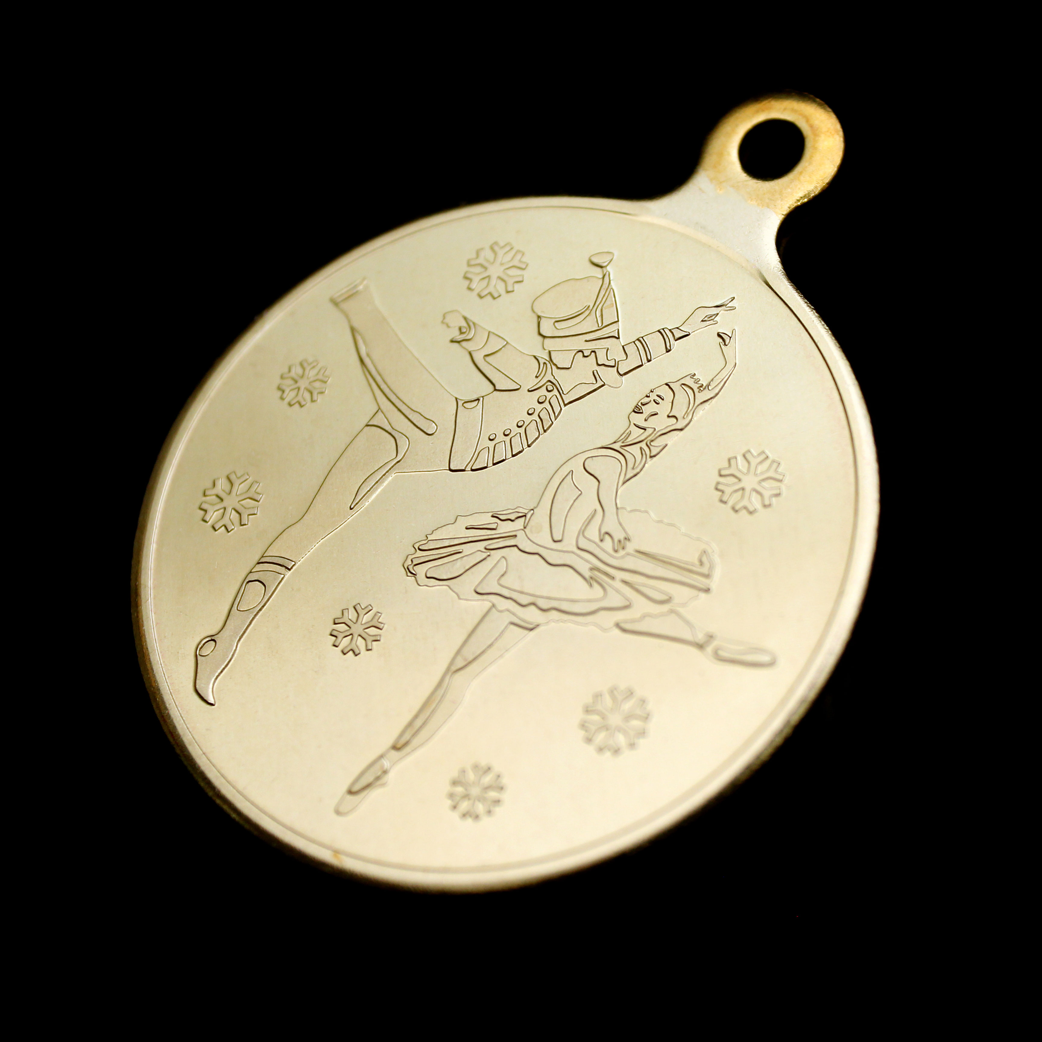 Close up of front of 50mm Gold minted frosted polished English National Ballet Commemorative Medal