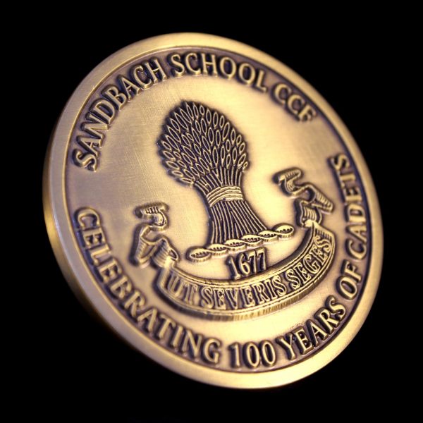 Close up of reverse of Sandbach School Cadets Medal on black background