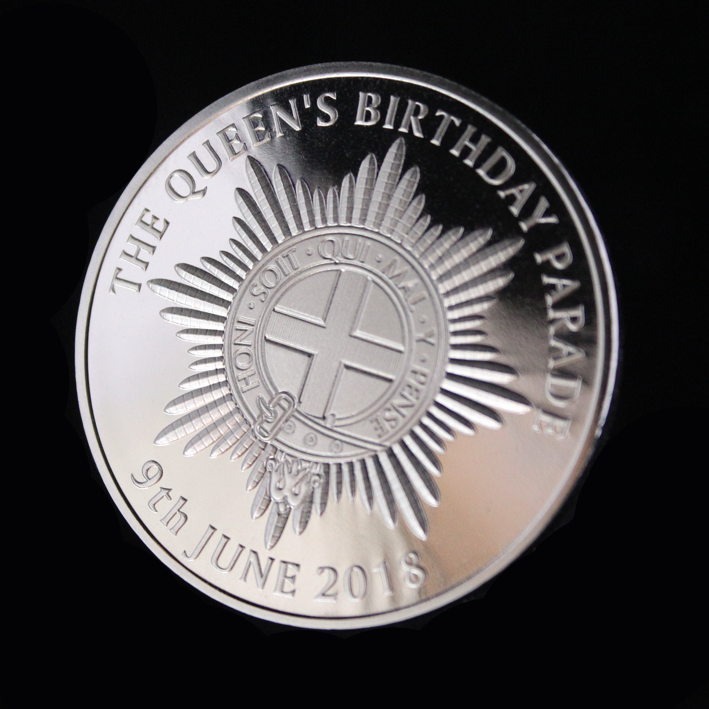 Close up of the Queens Birthday Parade Commemorative Coin